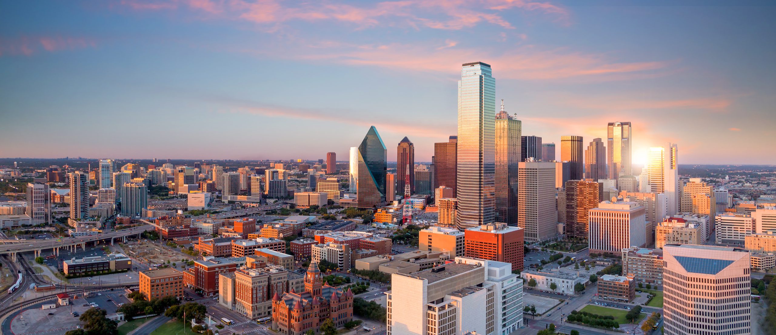 Dallas, Texas cityscape with blue sky at sunset